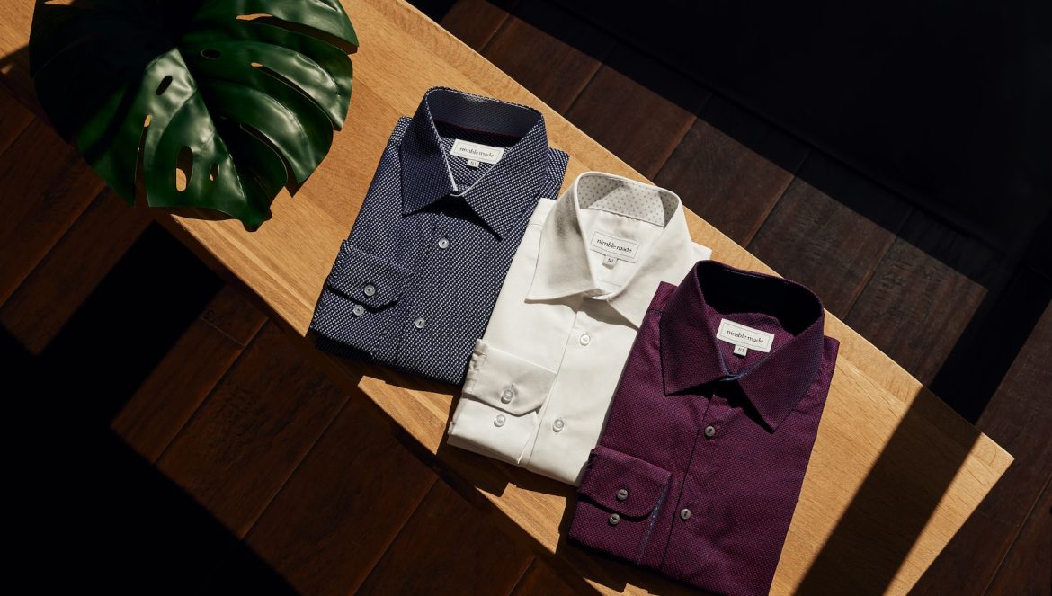 white button up shirt on brown wooden table